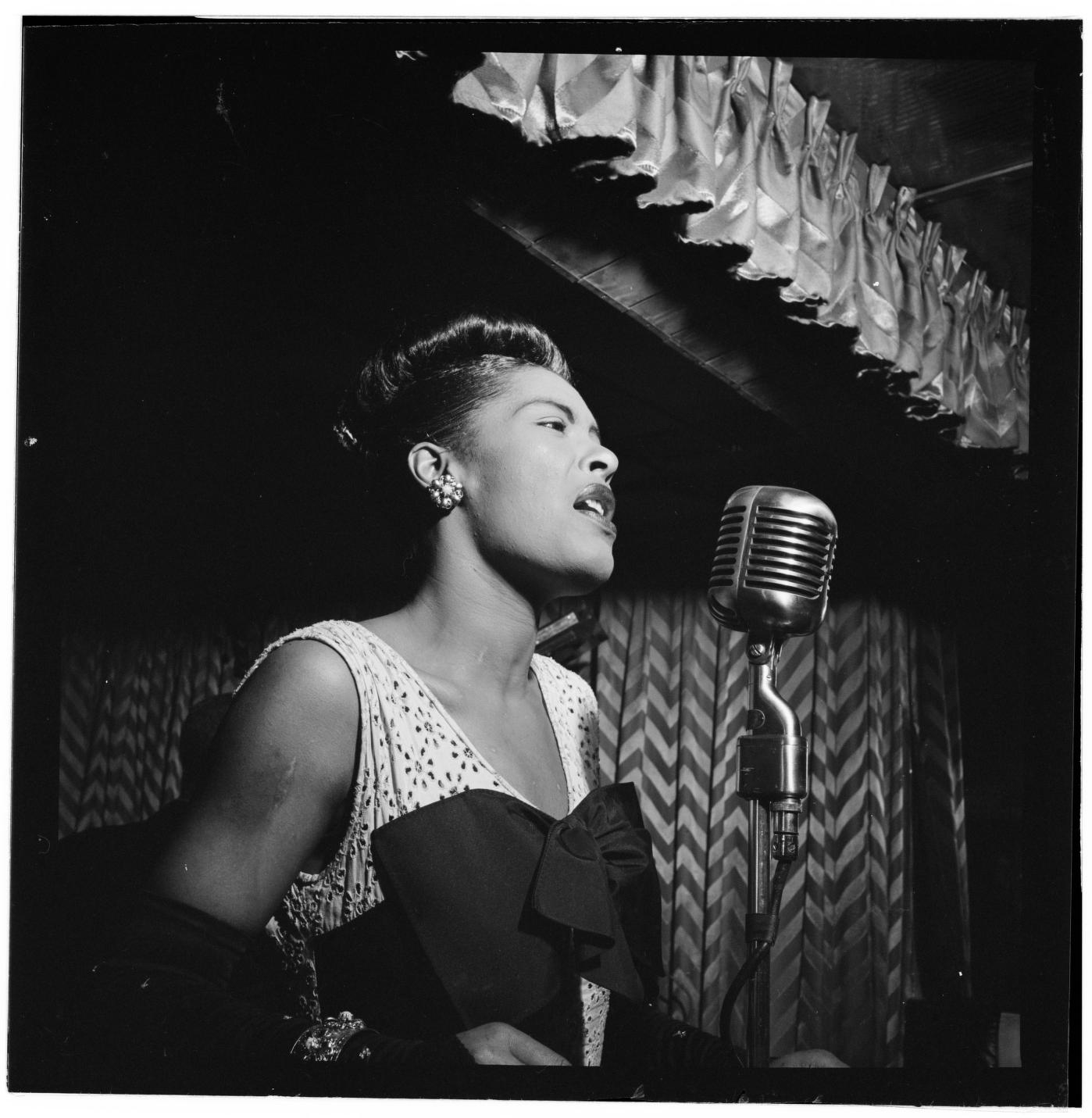 Billie Holiday singing at the Downbeat club, New York, 1947